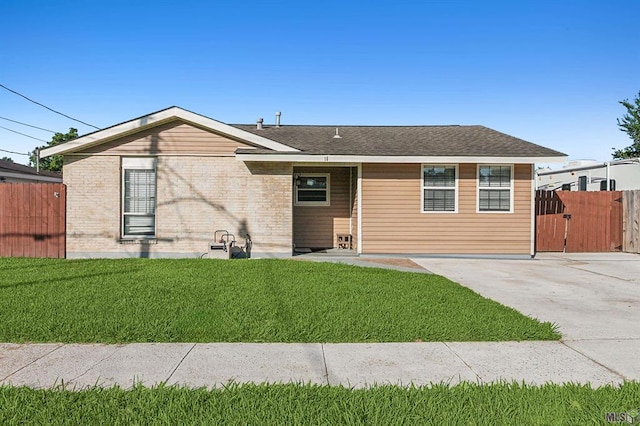 ranch-style house with a front lawn