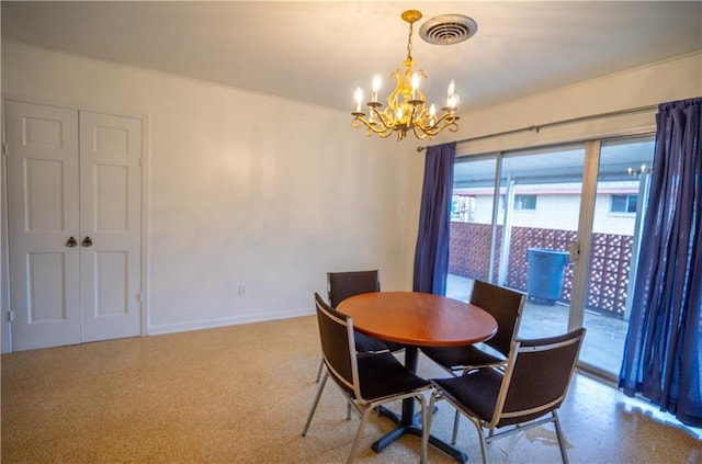 dining space with a notable chandelier