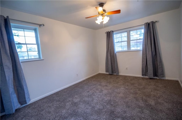 carpeted empty room featuring ceiling fan