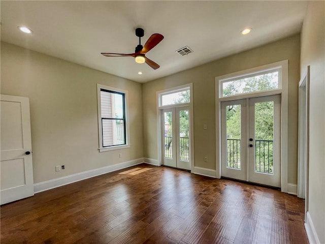 doorway to outside with ceiling fan, dark hardwood / wood-style flooring, and french doors