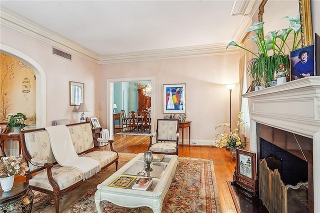 interior space with light wood-type flooring and ornamental molding