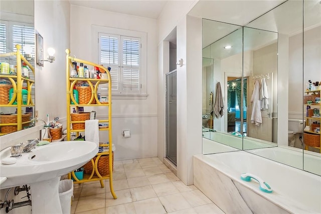 bathroom with tile patterned floors, sink, and independent shower and bath