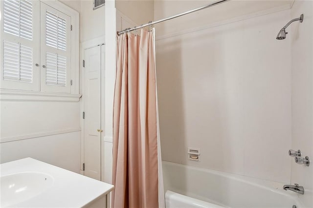 bathroom with vanity and shower / tub combo