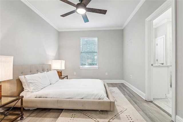 bedroom featuring ornamental molding, ceiling fan, and light hardwood / wood-style floors