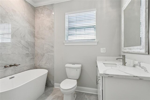 bathroom with tile patterned flooring, a washtub, toilet, vanity, and ornamental molding