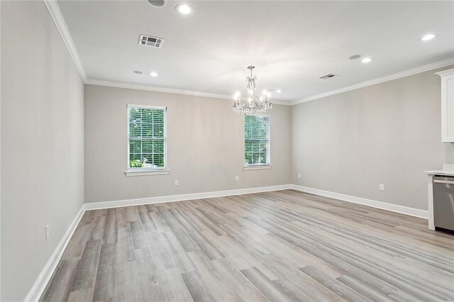 unfurnished living room with ornamental molding, a notable chandelier, and light hardwood / wood-style floors