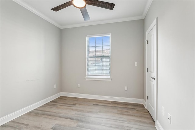 spare room featuring light hardwood / wood-style flooring, ceiling fan, and crown molding