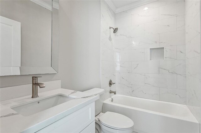 full bathroom with vanity, tiled shower / bath combo, toilet, and crown molding