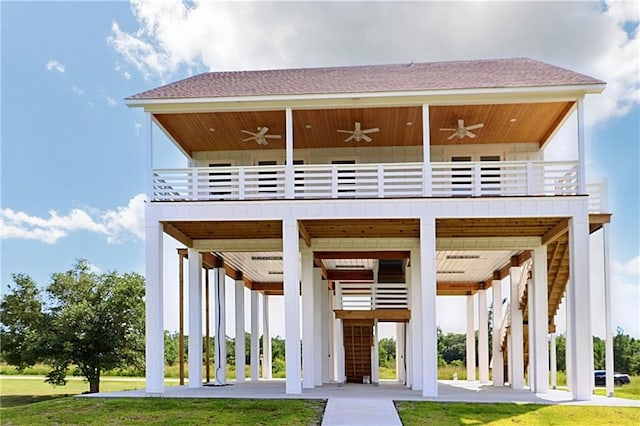 exterior space with a balcony and a yard