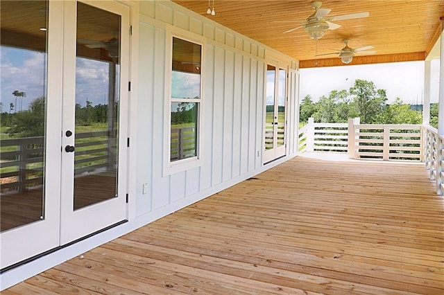 wooden deck with french doors and ceiling fan