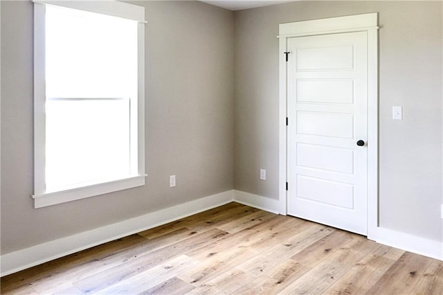 unfurnished room featuring light hardwood / wood-style floors