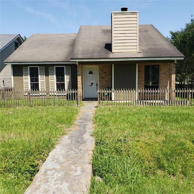117 Larry St, Lafayette, LA 70506 - view of front facade with a chimney, brick siding, and fence