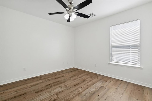 empty room featuring light hardwood / wood-style floors and ceiling fan