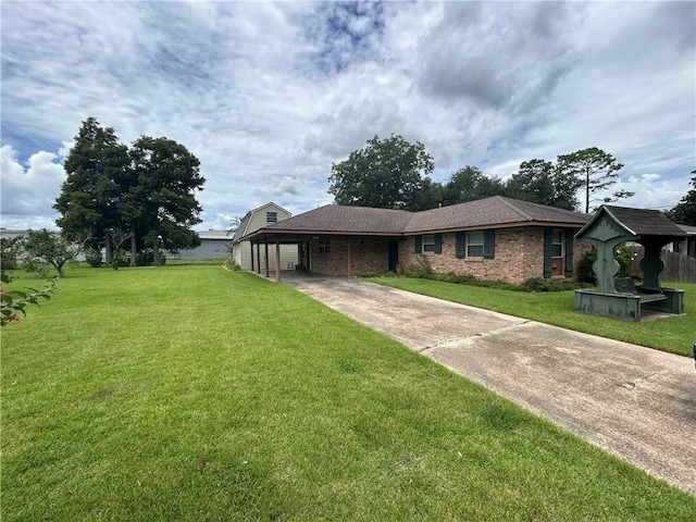 view of front facade with a front yard and a carport