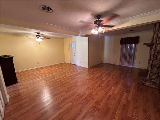 unfurnished living room with crown molding, hardwood / wood-style floors, and a textured ceiling