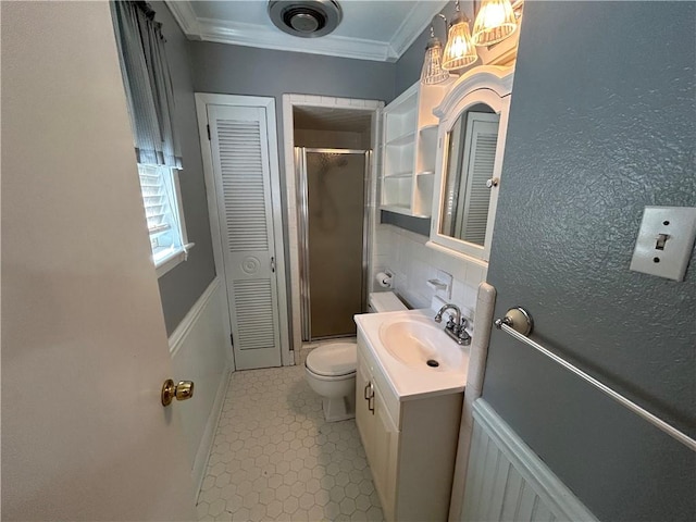 bathroom with tasteful backsplash, ornamental molding, vanity, toilet, and a shower with shower door