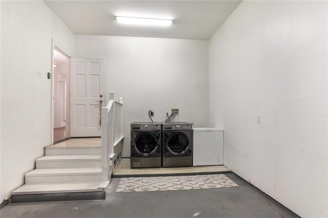 laundry area featuring washing machine and clothes dryer