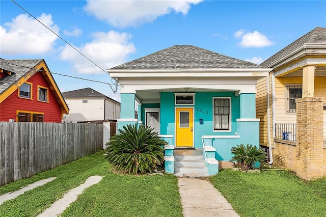 bungalow-style home featuring a front yard and a porch