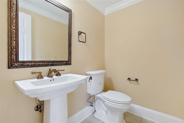 bathroom featuring ornamental molding, toilet, and tile patterned floors