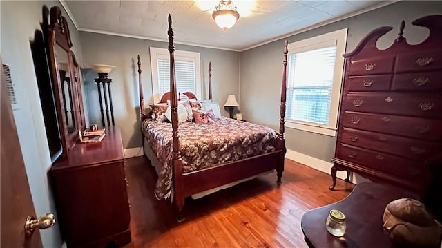 bedroom featuring crown molding and hardwood / wood-style floors