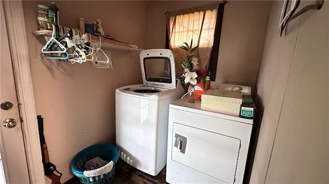 clothes washing area featuring washing machine and clothes dryer