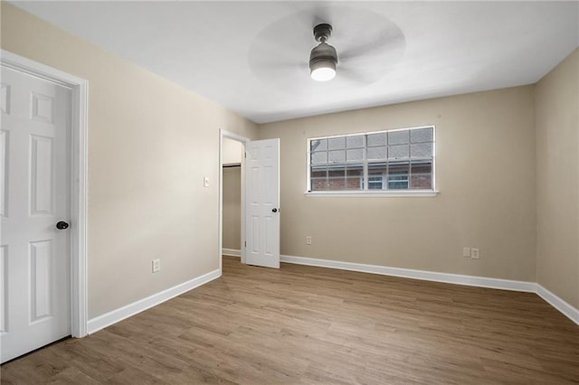 unfurnished bedroom featuring ceiling fan and light hardwood / wood-style floors