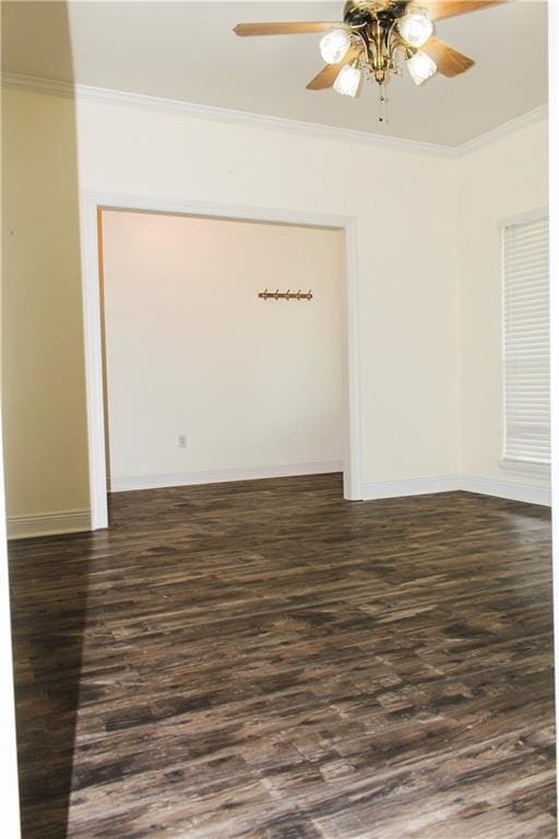 spare room with ceiling fan, ornamental molding, and dark hardwood / wood-style floors