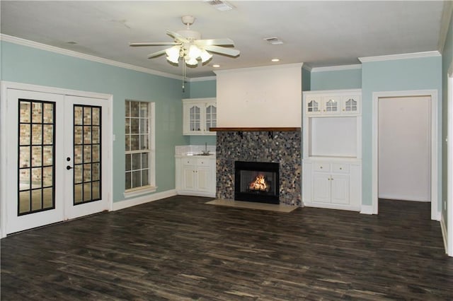 unfurnished living room with sink, ceiling fan, crown molding, dark wood-type flooring, and french doors