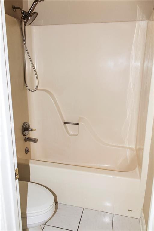 bathroom with  shower combination, toilet, and tile patterned flooring