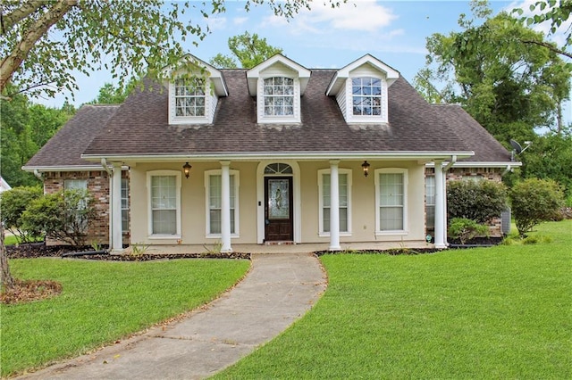 cape cod-style house with a front yard and a porch