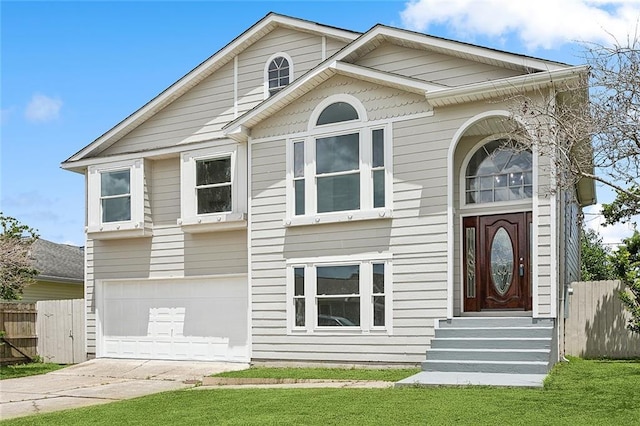 view of front of house with a front lawn and a garage