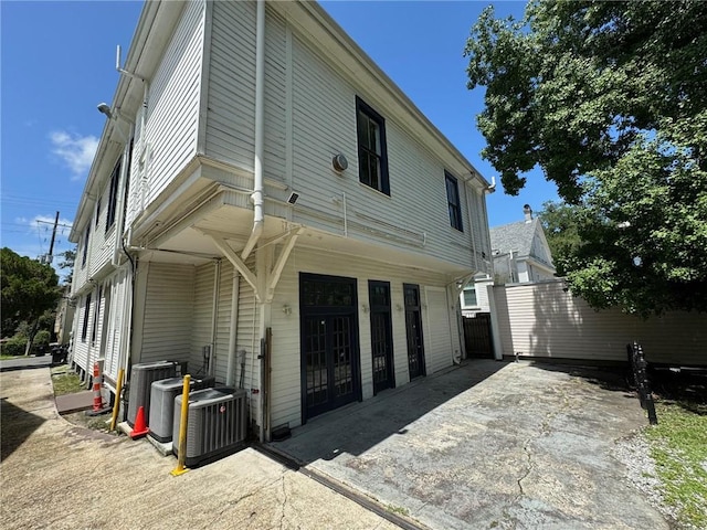 rear view of property with central air condition unit