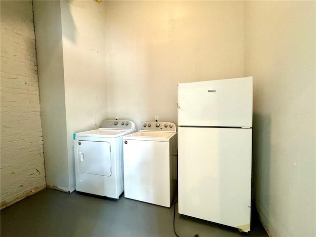 laundry area featuring washing machine and clothes dryer