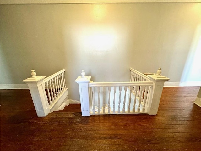 stairway with wood-type flooring