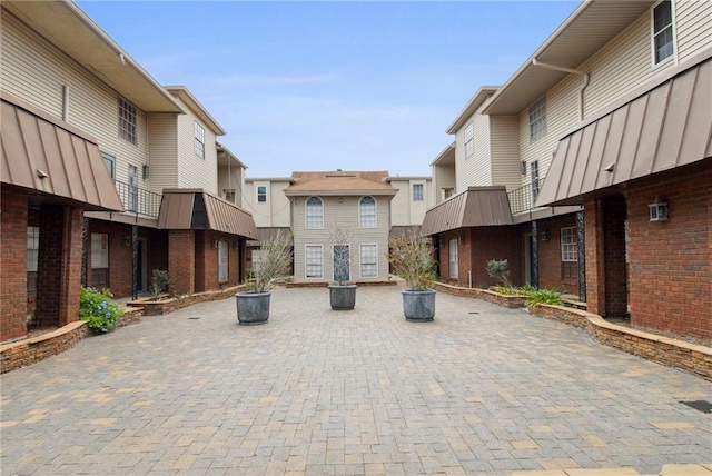 view of property's community featuring a patio