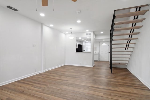 unfurnished living room with hardwood / wood-style floors