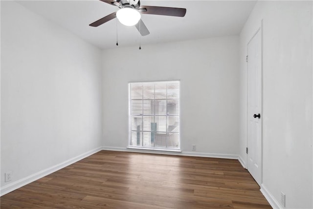 empty room featuring hardwood / wood-style flooring and ceiling fan