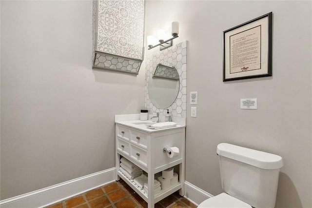 bathroom with toilet and vanity