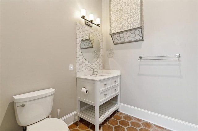 bathroom featuring tile patterned floors, toilet, and vanity