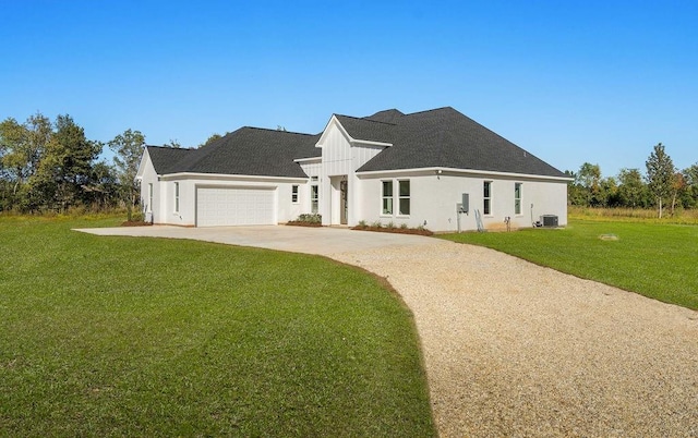 modern farmhouse style home with a front lawn and a garage