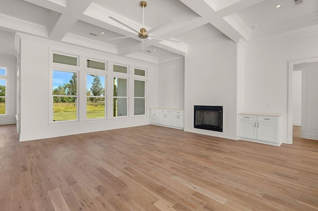 unfurnished living room with a large fireplace, beamed ceiling, light hardwood / wood-style floors, and ceiling fan