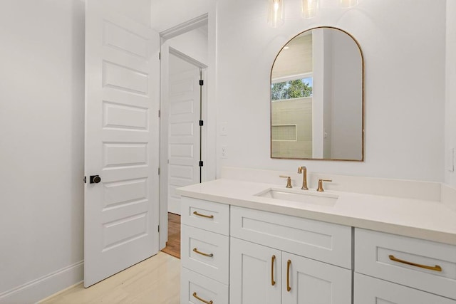 bathroom featuring vanity and wood-type flooring