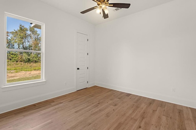 empty room featuring light hardwood / wood-style floors and ceiling fan