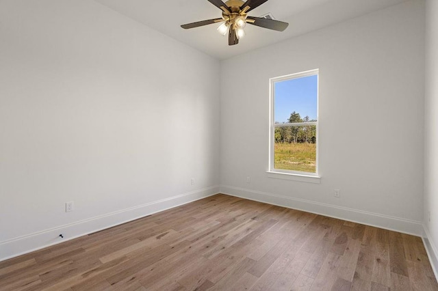 unfurnished room with light hardwood / wood-style flooring and ceiling fan