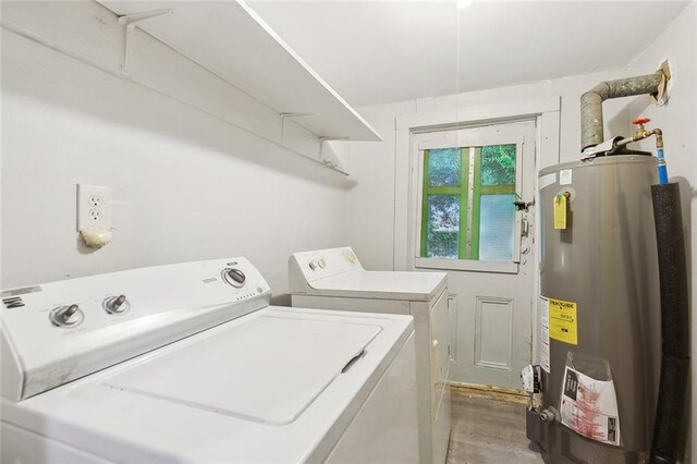 laundry area with separate washer and dryer and gas water heater