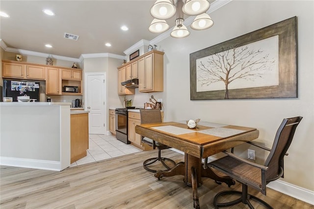 dining room featuring a notable chandelier, crown molding, and light hardwood / wood-style floors