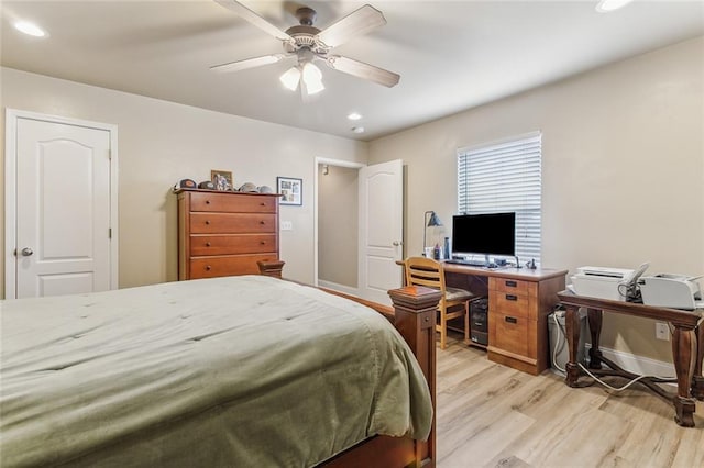 bedroom with light hardwood / wood-style floors and ceiling fan