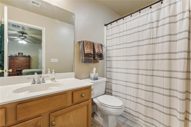 bathroom featuring ceiling fan, vanity, tile patterned flooring, and toilet