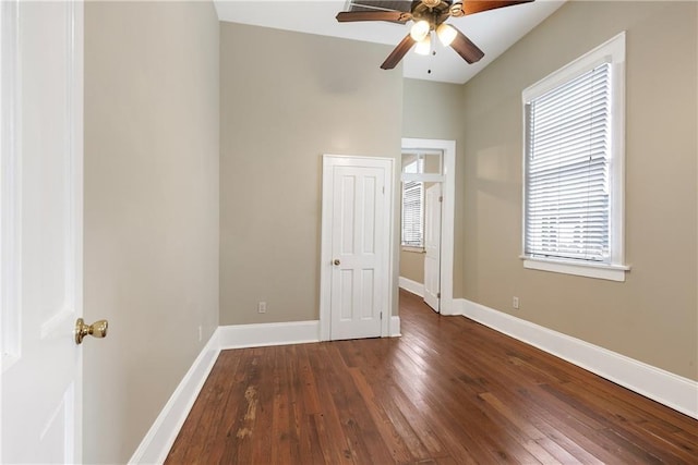 unfurnished bedroom with dark wood-type flooring and ceiling fan