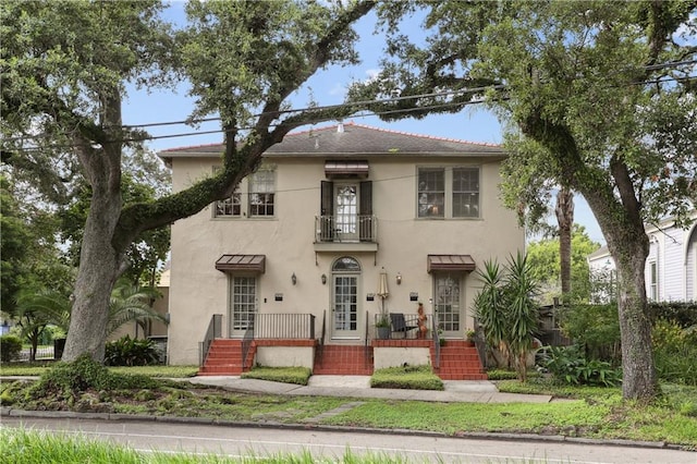 2900-04 Esplanade Ave, New Orleans, LA 70119 - view of front facade with a balcony and stucco siding
